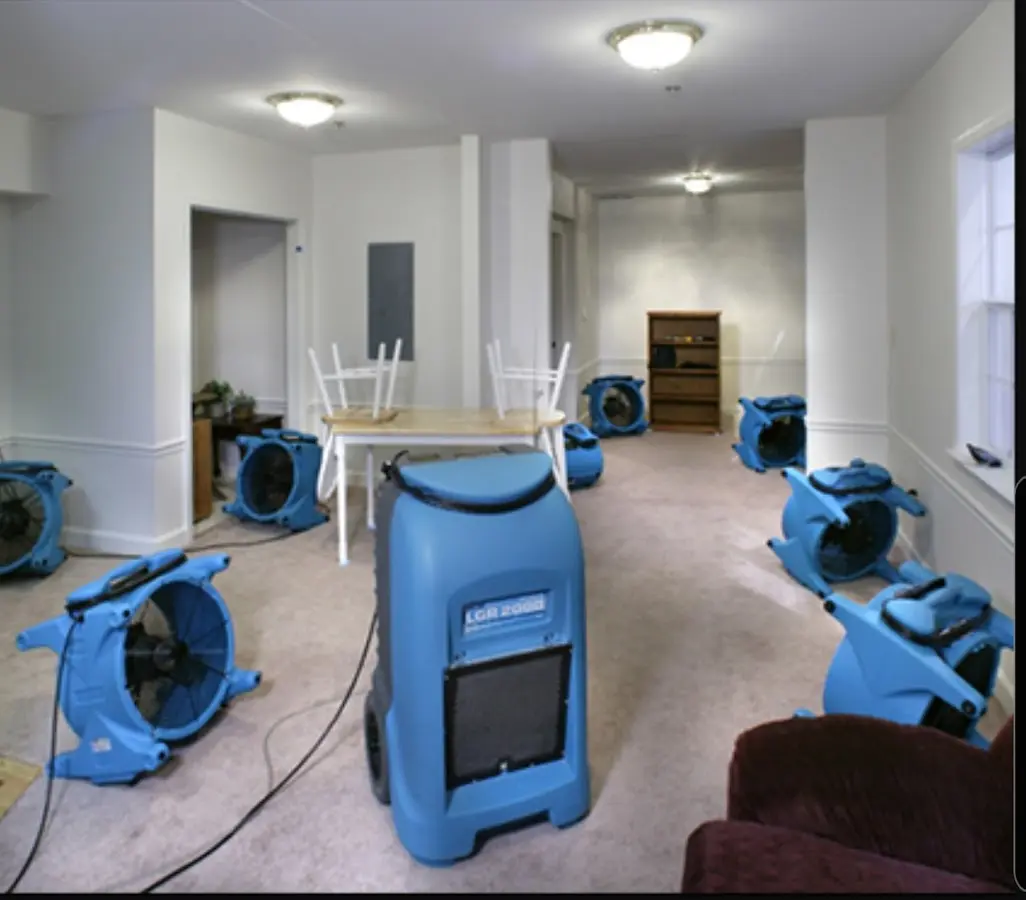 Air movers and dehumidifier setup for Water Damage Restoration in Roy